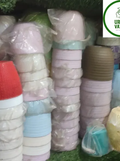 More small, colourful plastic pots.