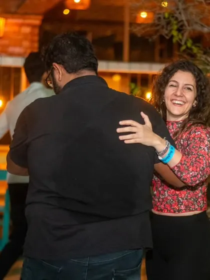 A warm hug and a smile from across the dance floor. The sense of community is strong here.