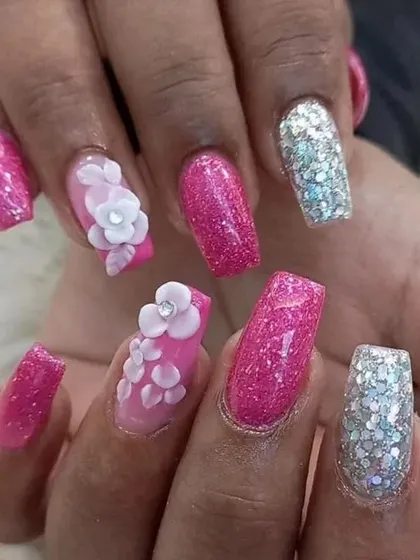 A close-up of the finished 3D floral and glitter set. The combination of textures and sparkle creates a dazzling, party-ready look.