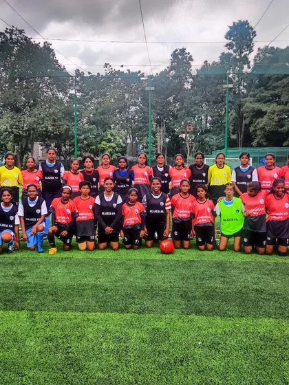 Our team poses with Anandpur FC after a friendly but competitive practice match, building relationships within the football community.