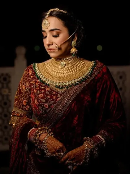 A close-up of a bride's intricate wedding look, featuring a deep velvet blouse and heavy gold jewelry. This showcases my ability to style rich, traditional aesthetics.