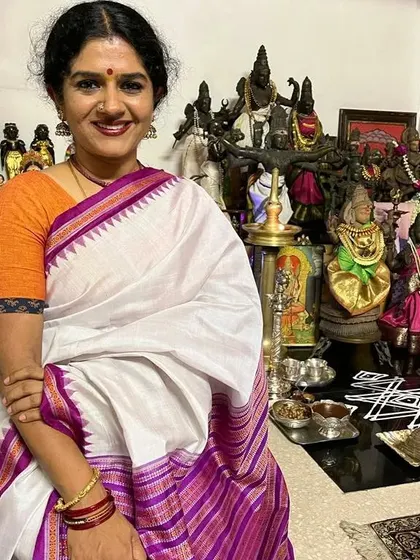 Posing in front of my home temple during Navaratri. The devotion and stories that are part of my daily life are the very same themes I explore on stage through Bharatanatyam.