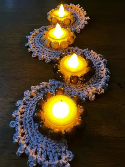 I love creating these for the festive season! These are my handmade crochet tea light candle holders, perfect for bringing a warm, beautiful glow to your home during Diwali. The way the light flickers through the stitches is just magical.