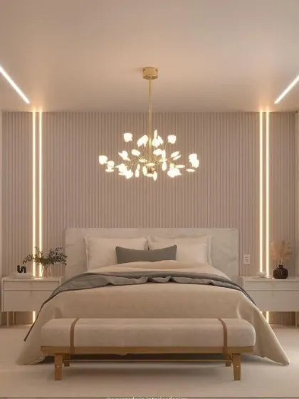 Soft, ambient lighting is the star of this serene bedroom. We used vertical LED strips to highlight the fluted wall panels, creating a gentle glow that complements the modern chandelier.