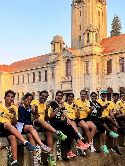 Another shot of our proud team with their medals at the Wings for Life World Run, in front of the iconic IISc Bangalore building.