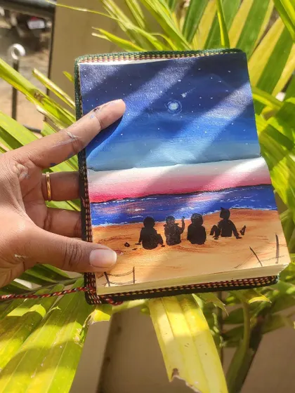 Holding up my sketchbook painting against a natural backdrop. I love how the colors of the sunset and the night sky in the painting contrast with the green leaves.
