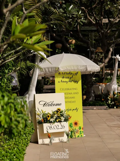 A personalized welcome sign with sunflower details greets guests as they arrive, setting the tone for the sun-drenched celebration.