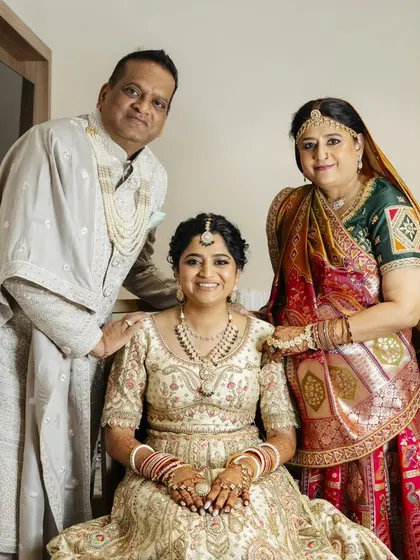 These heartwarming photos show the bride with her parents. I created coordinated, elegant makeup and hair for both the bride and her mother, ensuring everyone felt their best on this special family day.