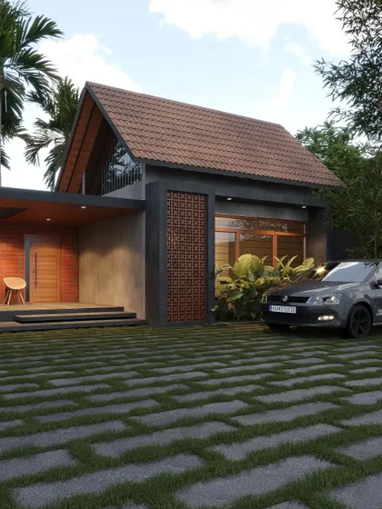 This design features a prominent terracotta jali screen next to the entrance, set against a concrete and brick facade with a gabled roof.