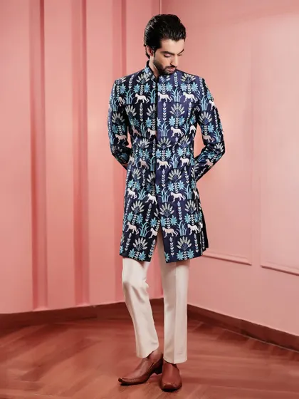 The full look, from head to toe. The printed Indo-Western jacket is paired with simple trousers and classic shoes, letting the jacket be the star of the show.