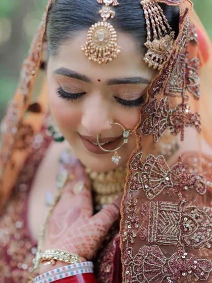 A close-up of a soft glam Sikh bridal look. Notice the gentle shimmer on the eyes and the perfectly blended skin that looks flawless even in natural light. For an Anand Karaj, I believe in creating an aura of grace and serenity.