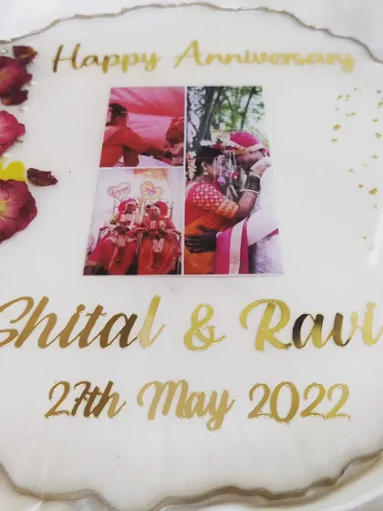 I love making memories for people. This anniversary platter preserves a couple's wedding photos along with their names and special date, surrounded by red rose petals and pearls.