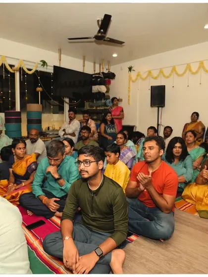 Our community sits together, absorbed in the devotional atmosphere of the Janmashtami celebration. It's a time for reflection, connection, and shared joy.