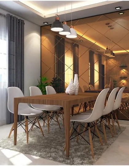This dining area uses a large bronze-tinted mirror wall to create a dramatic effect and visually expand the space. The simple wooden dining set is complemented by modern pendant lights, balancing warmth and contemporary style.