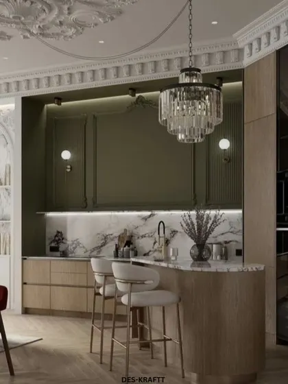 From this perspective, you can see the flow from the living area to the kitchen island, which features a curved wood base and provides casual seating for everyday moments.