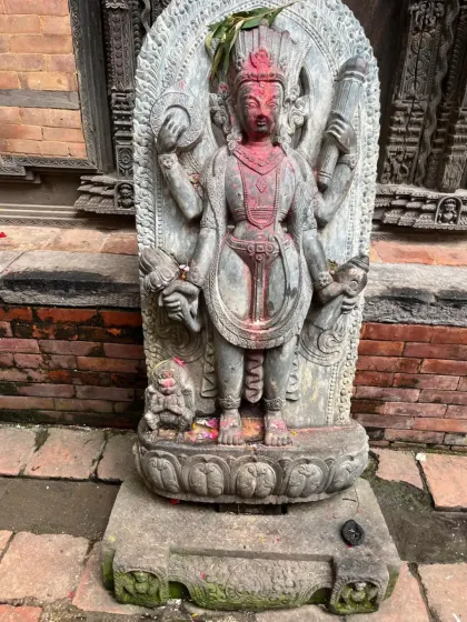 An ancient stone carving of a deity in Bhaktapur. The city is renowned for its artisans and the intricate details of its sacred art.