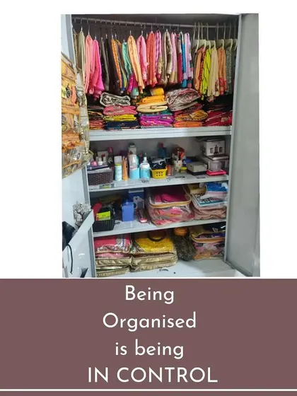 An organized Godrej wardrobe where traditional wear is hung, sarees are folded, and daily essentials are stored in easy-to-access bags. Being organized is about being in control of your space.