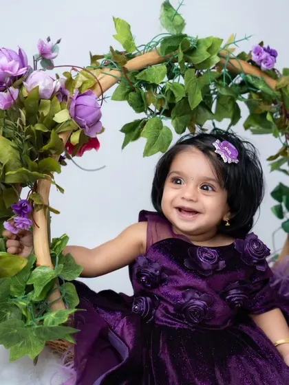 Every milestone is worth celebrating, from their first smile to sitting up on their own. This sitter session features a beautiful floral swing prop, one of over 100 creative setups available in my studio to capture your baby's unique personality.