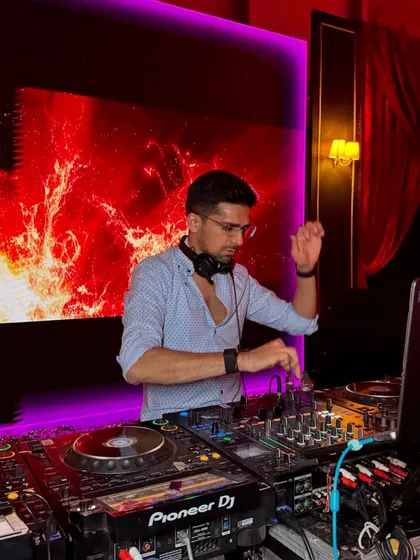 In my element at a club gig, with a fiery visual display behind me. I love the intensity and focus of a great club night.