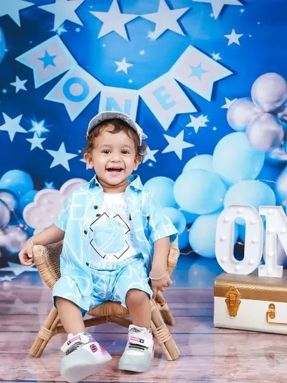 Another angle of the starry blue first birthday theme, showing the full setup with balloons and decorations.