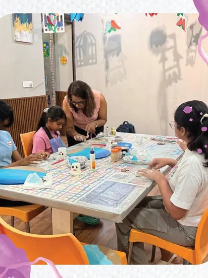 I'm providing guidance to a group of students during a resin art class. I ensure everyone understands the steps and can work safely to create their beautiful pieces.