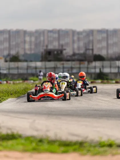 A train of karts snakes through a section of the track, demonstrating the close-fought nature of our races.