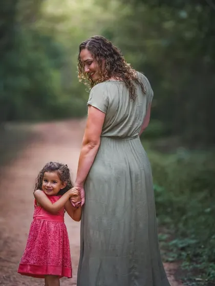 The bond between a mother and daughter is a story I never tire of telling. Here, Jordana and her little girl share a quiet moment, a simple look back that holds so much love.