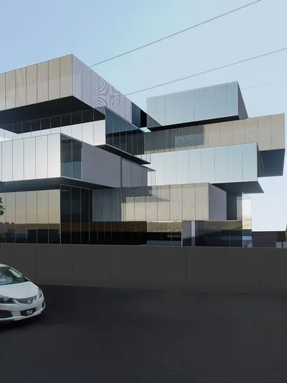 Another view of the headquarters transformation, showing how the stacked volumes create a sense of movement and complexity. The reflective and solid panels play with light and shadow, giving the building a different character throughout the day.