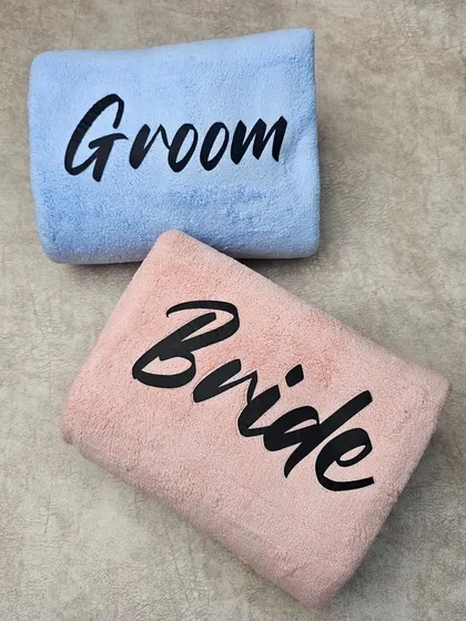 A top-down view of the personalized towel set. This is a simple yet thoughtful gift that a couple can use every day.