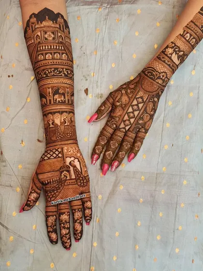 A stunning example of asymmetrical traditional design. One hand features a full baraat scene, while the other has a delicate jaali pattern, creating a unique and balanced look.