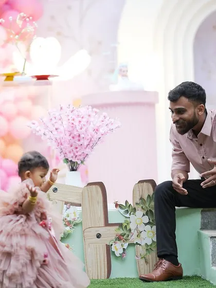 A sweet, candid moment between a father and his daughter at her enchanted fairy garden-themed birthday party. These are the precious memories we love to help create.