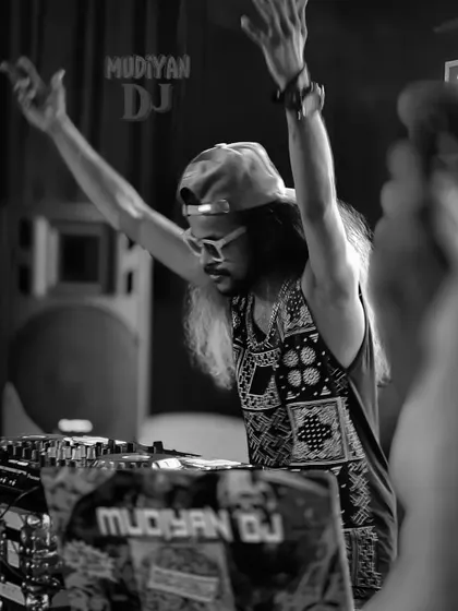A black and white shot of me with my hands up, feeling the energy of the music and the crowd.