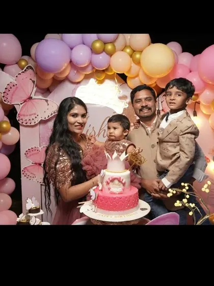 A happy family photo from a butterfly-themed first birthday party. Our decorations create the perfect backdrop for capturing these precious milestone moments.