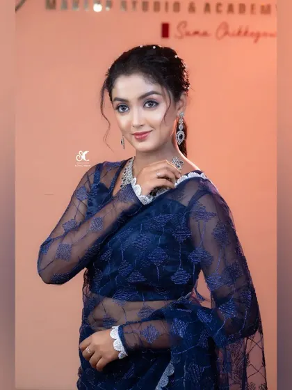 A portrait for the Anubandha Awards, showcasing a beautiful blue sheer saree. This is a collaboration with a makeup artist and jewelry rental brand.