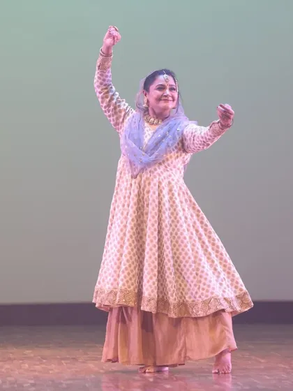 A Kathak dancer mid-performance, her graceful posture and expression telling a story. Our classical classes delve deep into the narrative aspects of Indian dance.
