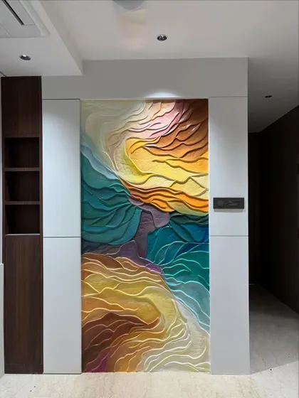 This large-scale abstract wall installation uses flowing, wave-like forms and a vibrant color gradient to bring life to a modern interior. The 3D texture is designed to catch light from different angles, creating a constantly changing visual effect that is both calming and energetic.