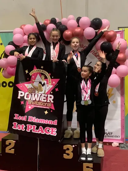 First place feels AMAZING! Our Xcel Diamond team celebrates a huge win at the Svetlana Boguinskaia Invitational. Teamwork, friendship, and hard work paying off is what our competitive program is all about.