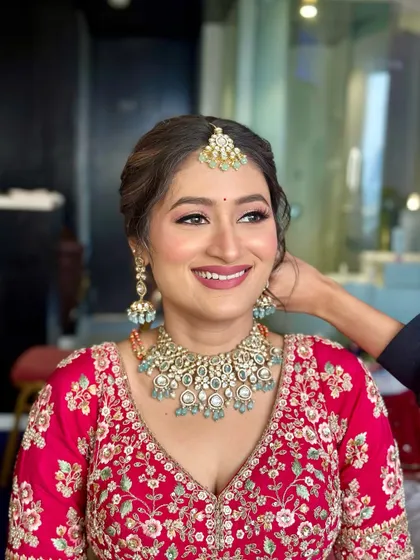 A beautiful floral bun for a Phera ceremony. I used a mix of pink and white flowers to create a soft, romantic look that complements the bride's pink lehenga.