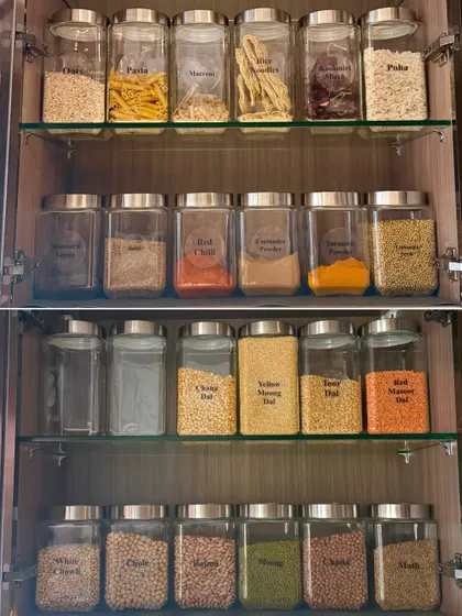 Imagine a pantry where every dal, grain, and snack is visible and fresh. We use decanting and clear labeling to create a system that prevents duplicate purchases and makes finding ingredients a breeze.