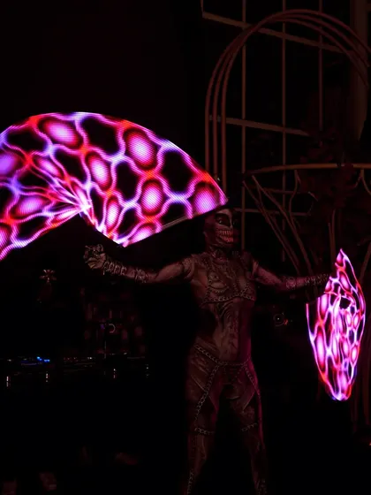 Channeling a cyberpunk theme with programmable pixel fans for a Halloween event. These high-tech props can display intricate patterns and logos, offering a fully customizable light show for any theme.