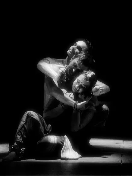 An intimate and powerful moment from 'Naga Mandala'. This black and white photo highlights the raw emotion and physical storytelling of the piece.
