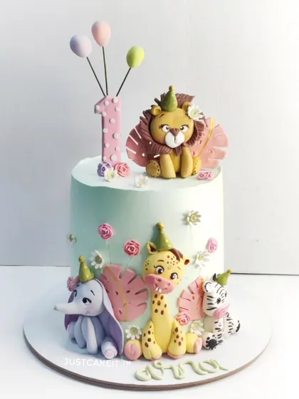 For a little one's first birthday, I crafted this adorable jungle-themed cake. All the cute animals, from the lion to the elephant, are handmade and completely edible, making it a sweet and whimsical centerpiece for a precious milestone.