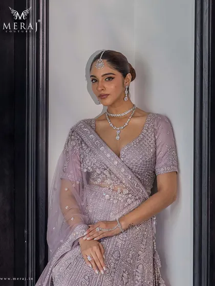 A closer look at the lilac lehenga, highlighting the intricate sequin detailing and delicate threadwork that make it a masterpiece of design.