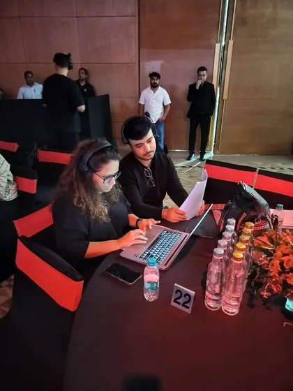 Our team reviewing the script at the Kinetic Green & Tonino Lamborghini launch. We ensure every detail is double-checked.