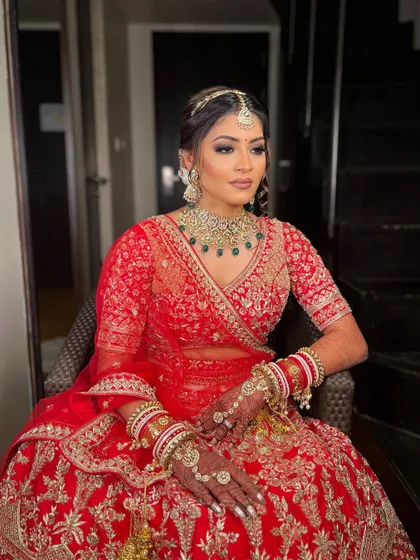Krisha looking absolutely breathtaking in her traditional red bridal lehenga. I created a classic bridal look with a soft smokey eye and a neutral lip to balance her magnificent jewelry.