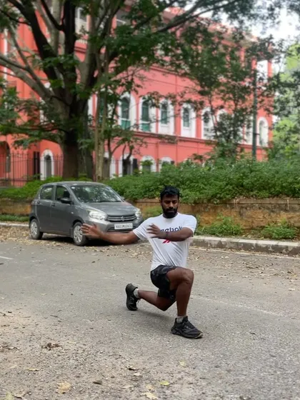 A forward lunge with a twist. This warm-up exercise activates the core and improves spinal mobility along with stretching the hip flexors.