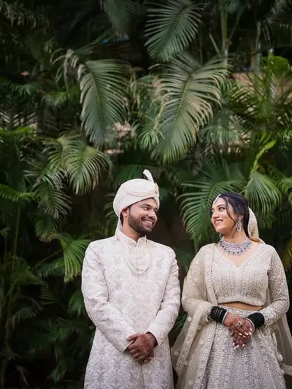 Aishwarya and Bipinsagar share a look of love, framed by the lush palms of Mumbai.