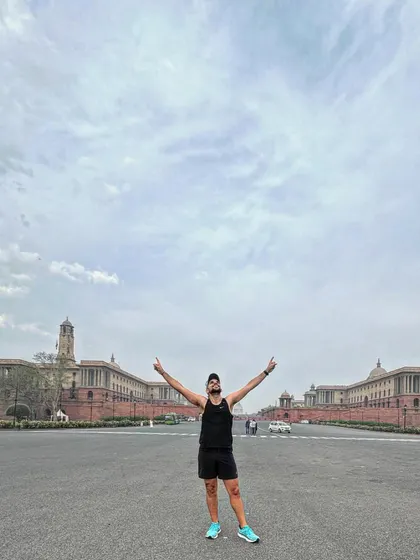 A moment of pure joy and gratitude after a long run, with Rashtrapati Bhavan in the background. Running in the heart of Delhi is always special.