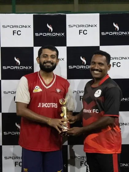 A moment of sportsmanship as the runners-up trophy is awarded. We believe in celebrating participation and effort in all our tournaments.
