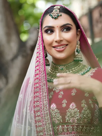 A beautiful outdoor bridal shoot. Students learn how to adapt makeup for different lighting conditions, ensuring the bride looks flawless whether indoors or in natural daylight.